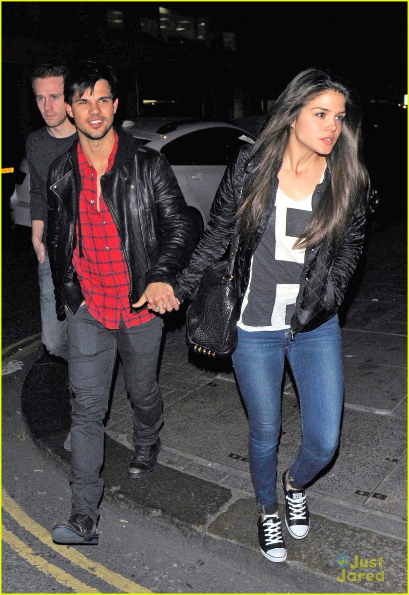 taylor lautner marie avgeropoulos matching jackets london 14